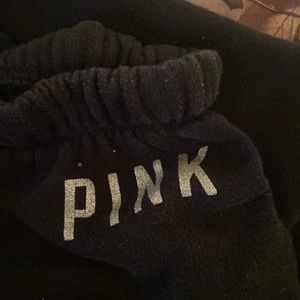 Pink sweatpants, has small stain on front on left leg.
